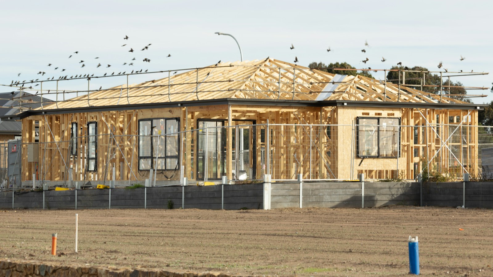 Illustrative photo of a timber house frame under construction